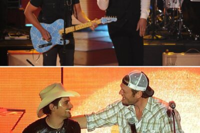 Country music royalty collided in an unforgettable night at Darien Lake! Brad Paisley and Blake Shelton hit the stage for a powerhouse duet of Don’t Drink the Water, and the crowd went wild. With Paisley’s signature guitar licks and Shelton’s rugged charm, the performance was pure country magic. The energy was electric, the harmonies were flawless, and the banter between these two legends had everyone roaring with laughter. This wasn’t just a concert—it was a moment country fans will be talking about for years!