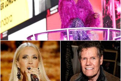At Opry 100 – A Live Celebration, Carrie Underwood delivered a breathtaking tribute to Randy Travis, moving the entire audience to tears. As she poured her heart into the song, she made the moment even more powerful by handing the mic to Randy Travis, honoring the legend in a way that only she could. The gesture was a poignant reminder of their deep connection, dating back to when he invited her to join the Opry family years ago. Blake Shelton, hosting the historic event, looked on with admiration as the crowd rose to their feet in an emotional standing ovation. Carrie’s performance wasn’t just a tribute—it was a full-circle moment that celebrated the legacy of one of country music’s greatest icons.